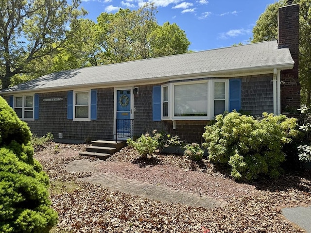 39 Pine Grove Rd, Yarmouth, MA 02664 - ranch-style house featuring a chimney and roof with shingles