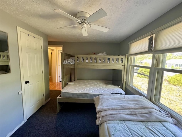 39 Pine Grove Rd, Yarmouth, MA 02664 - bedroom with a textured ceiling and a ceiling fan