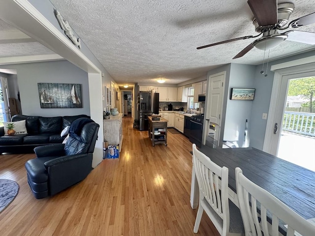 39 Pine Grove Rd, Yarmouth, MA 02664 - living area with ceiling fan, light wood-style flooring, and a textured ceiling