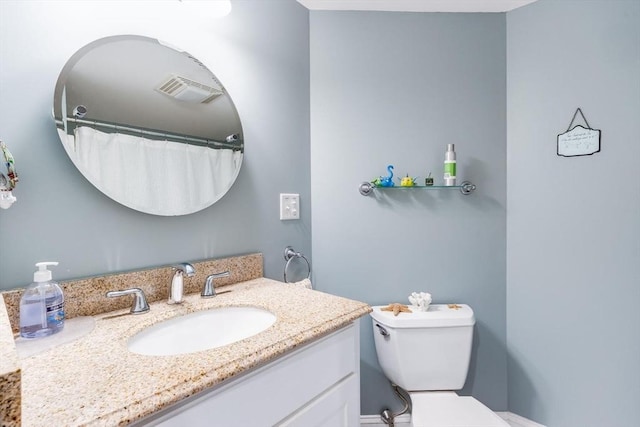 full bath with toilet, visible vents, and vanity