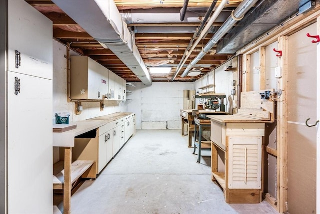 unfinished below grade area featuring a workshop area
