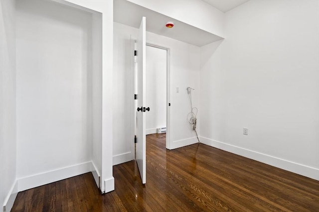 laundry area featuring dark hardwood / wood-style flooring