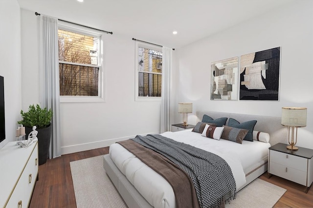 bedroom with dark wood-type flooring