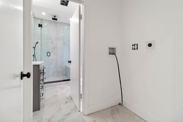 bathroom featuring vanity and an enclosed shower