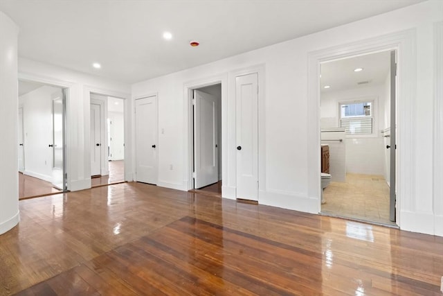 spare room with hardwood / wood-style flooring