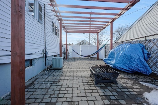 view of patio / terrace featuring a pergola, a fenced backyard, a fire pit, and central air condition unit