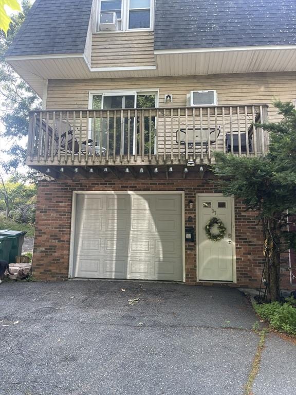 garage featuring aphalt driveway