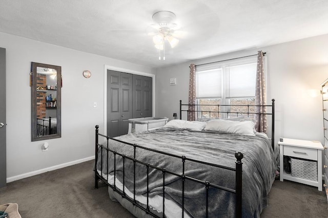 carpeted bedroom with baseboards, a closet, and ceiling fan