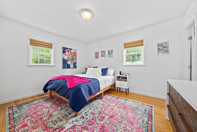 16 Chandler Dr, Marshfield, MA 02050 - bedroom with multiple windows, baseboards, and light wood-style floors