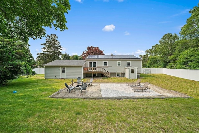 16 Chandler Dr, Marshfield, MA 02050 - rear view of house featuring an outdoor fire pit, a wooden deck, a patio, stairs, and an outbuilding