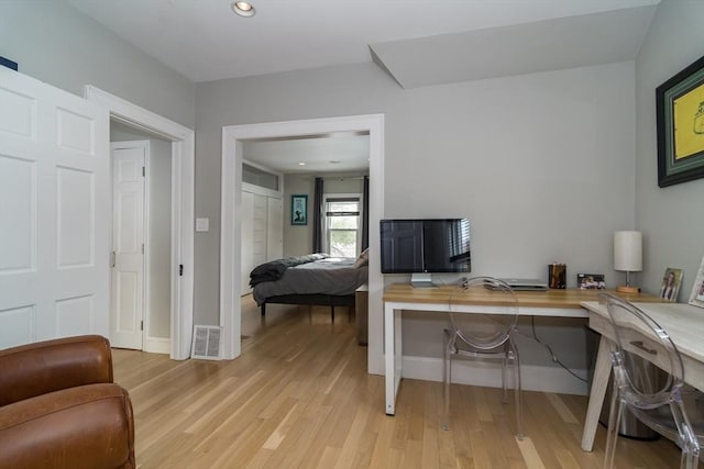 office with light wood-style floors, baseboards, visible vents, and recessed lighting