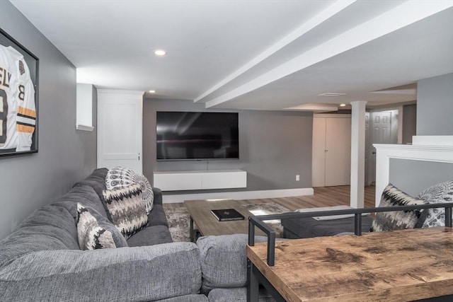 living room featuring wood finished floors, baseboards, and recessed lighting