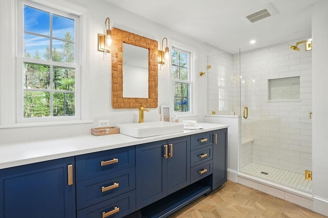 full bathroom with recessed lighting, visible vents, a shower stall, and vanity