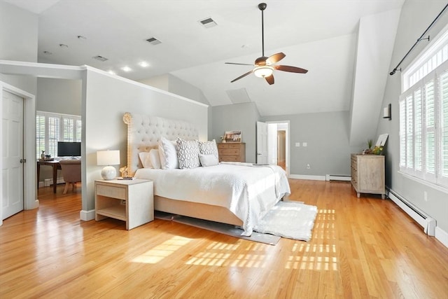 bedroom with high vaulted ceiling, a baseboard heating unit, and multiple windows