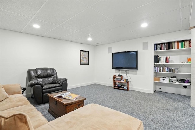 living area with recessed lighting, carpet, a paneled ceiling, and baseboards