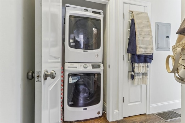 200 W 8th St Unit 1, Boston, MA 02127 - washroom with stacked washer / drying machine, electric panel, baseboards, and wood finished floors