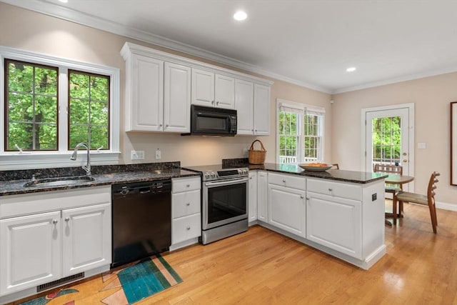 138 Worcester Ln, Waltham, MA 02451 - kitchen featuring black appliances, a sink, crown molding, a peninsula, and white cabinets