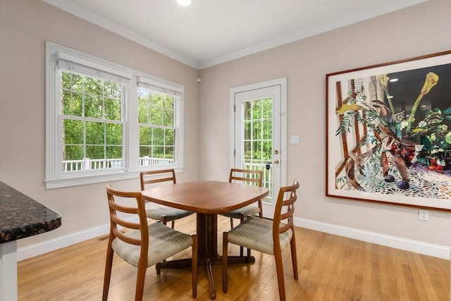 138 Worcester Ln, Waltham, MA 02451 - dining room featuring baseboards, light wood finished floors, and ornamental molding