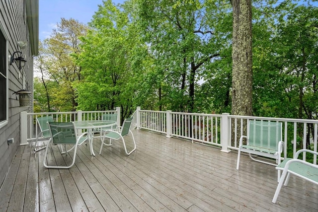 138 Worcester Ln, Waltham, MA 02451 - deck with outdoor dining space and view of wooded area