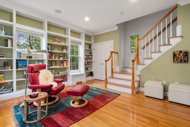 138 Worcester Ln, Waltham, MA 02451 - sitting room featuring wood finished floors, stairs, ornamental molding, built in features, and baseboards