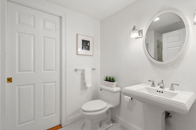 138 Worcester Ln, Waltham, MA 02451 - bathroom with baseboards, toilet, and tile patterned floors