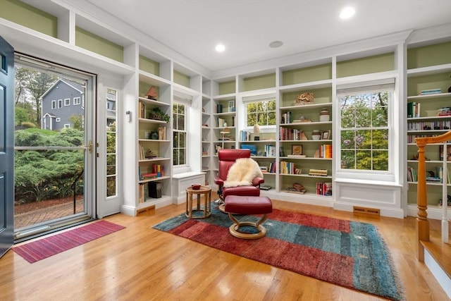 138 Worcester Ln, Waltham, MA 02451 - living area featuring wood finished floors, built in features, and recessed lighting