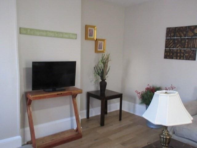 sitting room with wood finished floors