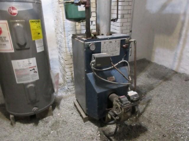 utilities featuring water heater and a heating unit