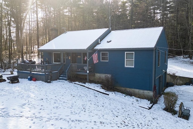 view of front of property with a porch and a garage