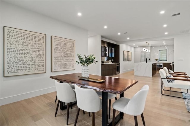 116 Thorndike Rd, Brookline, MA 02446 - dining room with light wood finished floors, recessed lighting, and wine cooler