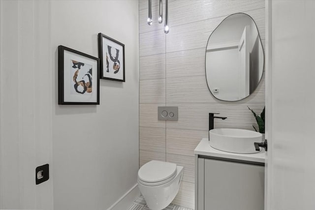 116 Thorndike Rd, Brookline, MA 02446 - bathroom with vanity, tile walls, and tile patterned flooring