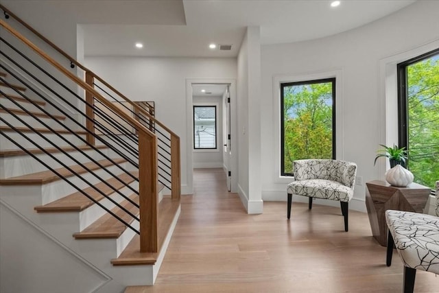 116 Thorndike Rd, Brookline, MA 02446 - entrance foyer featuring light wood-style flooring, recessed lighting, and stairs