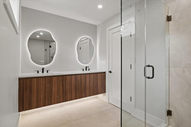 116 Thorndike Rd, Brookline, MA 02446 - bathroom with double vanity, a stall shower, tile patterned flooring, and recessed lighting