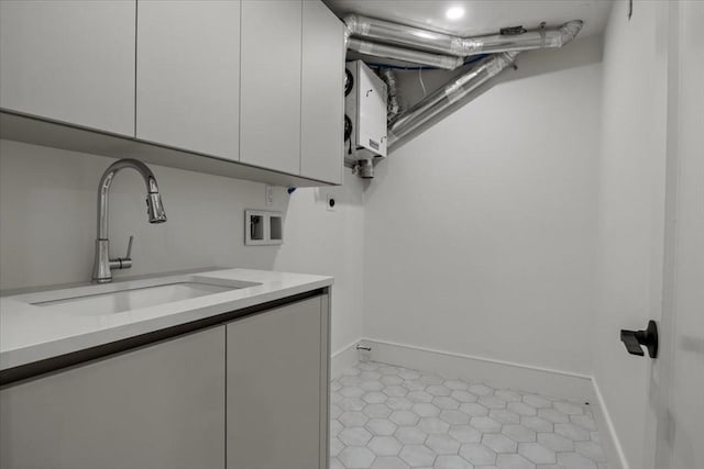 116 Thorndike Rd, Brookline, MA 02446 - washroom featuring cabinet space, electric dryer hookup, and washer hookup