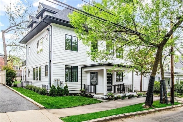 116 Thorndike Rd, Brookline, MA 02446 - american foursquare style home with a porch and roof with shingles
