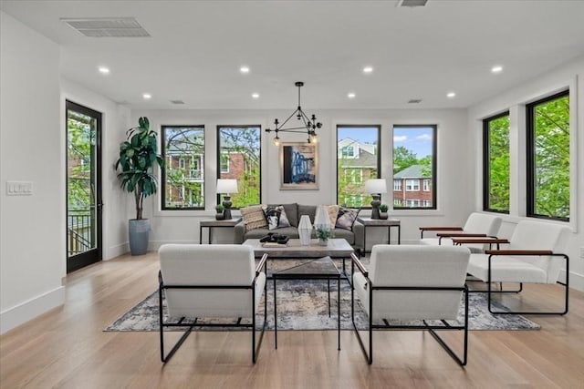 116 Thorndike Rd, Brookline, MA 02446 - living room featuring recessed lighting, light wood-style floors, and a chandelier