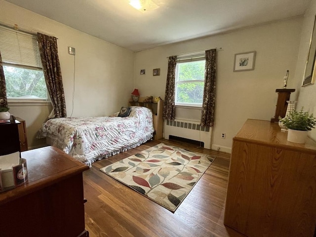 45 Leonard St, Dedham, MA 02026 - bedroom featuring radiator heating unit and wood finished floors