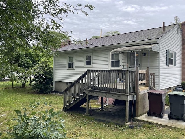 45 Leonard St, Dedham, MA 02026 - rear view of property with roof with shingles, a wooden deck, stairs, and a lawn