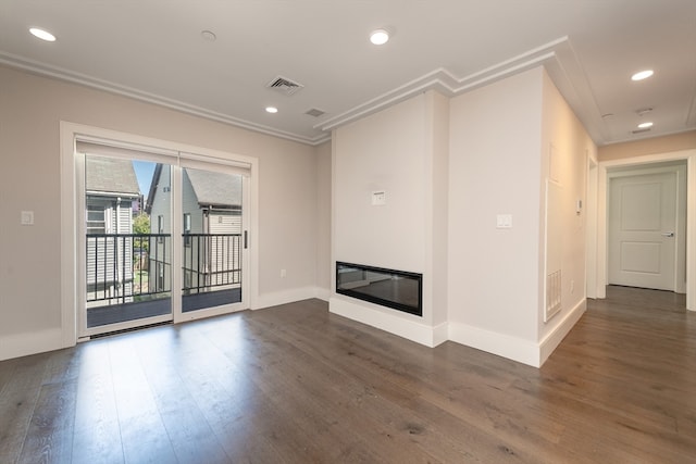 unfurnished living room featuring crown molding and dark hardwood / wood-style floors