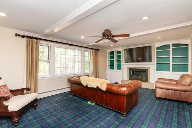 carpeted living area with ornamental molding, a glass covered fireplace, baseboards, a baseboard heating unit, and a ceiling fan