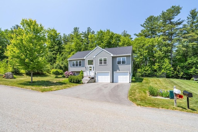 380 Leo Dr, Gardner, MA 01440 - split foyer home featuring driveway, a garage, and a front yard