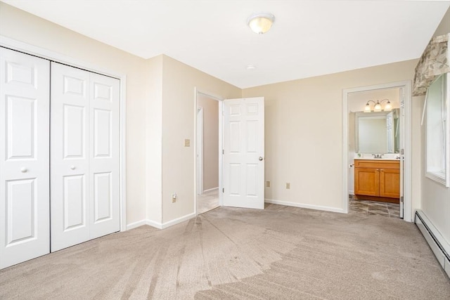 380 Leo Dr, Gardner, MA 01440 - unfurnished bedroom with baseboard heating, carpet floors, baseboards, and a closet