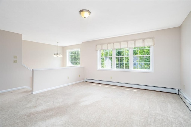 380 Leo Dr, Gardner, MA 01440 - carpeted empty room with a chandelier, baseboard heating, and baseboards