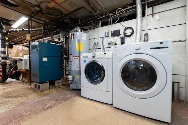 laundry area with laundry area, washer and clothes dryer, and gas water heater