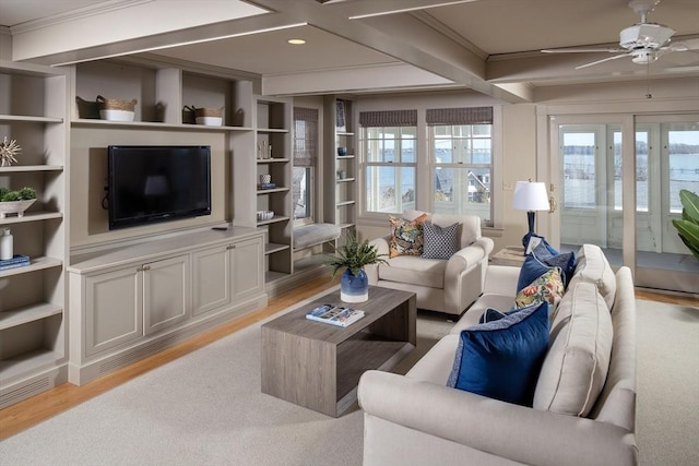 living room with light wood-style flooring, coffered ceiling, crown molding, and ceiling fan