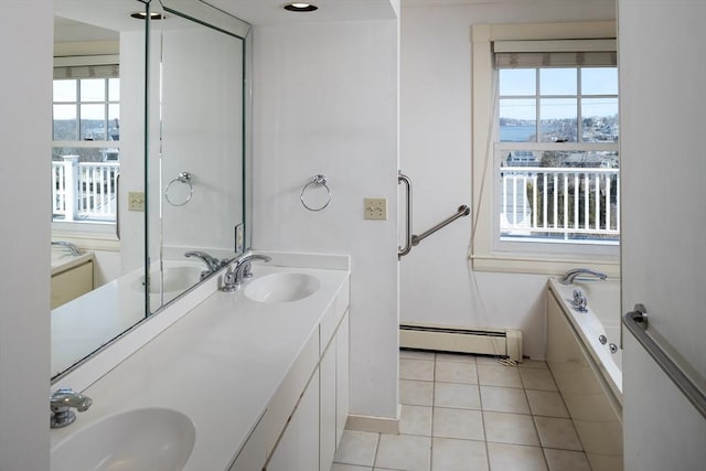 bathroom featuring a sink, tile patterned floors, and a baseboard radiator