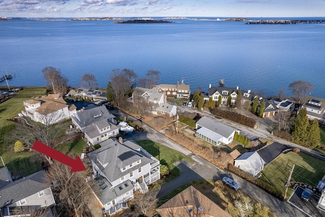 birds eye view of property with a residential view and a water view