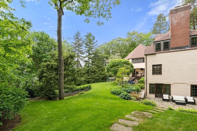 85 Gate House Rd, Newton, MA 02467 - view of green lawn with outdoor lounge area and a patio