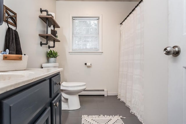 bathroom featuring a baseboard radiator, vanity, toilet, and tile patterned flooring