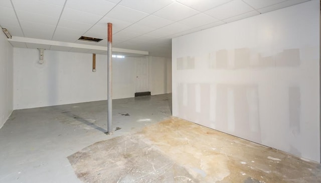 basement featuring a paneled ceiling